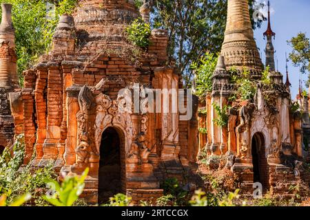 Pagodas and stupas in the Buddhist cemetery of the impressive In-Dein Pagoda Forest on Inle Lake in Myanmar Stock Photo