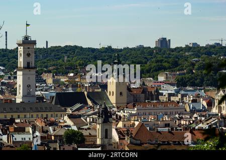 The historic city center of Lviv, old houses in the old town, Tower of City Hall on the Market Square. Lvov, Ukraine. Stock Photo