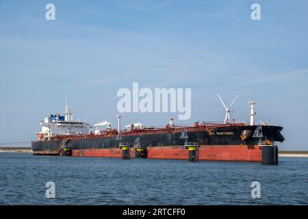 Large LNG tanker ship in a harbour on a clear summer day. Port of Rotterdam, the Netherlands. Stock Photo