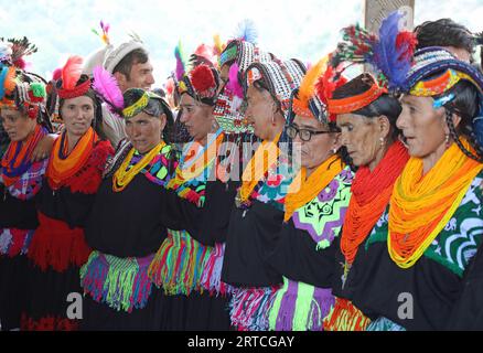 Kalesh women dancing at the Uchal Summer Festival Stock Photo