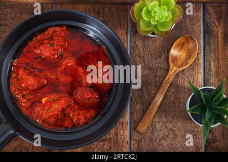 Famous lamb recipe called Mutton Rogan josh or lamb rogan josh,Indian mutton curry prepared with spices and served with plain rice, chapati, roti or b Stock Photo
