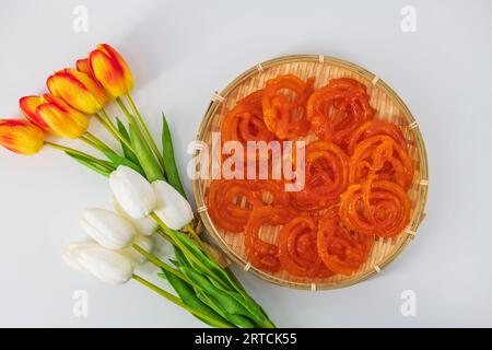 Jalebi or Jilebi Jangri - traditional Indian festival sweet isolated with white background. Popular Indian sweet Jalebi and Fafda served with Sambhara Stock Photo