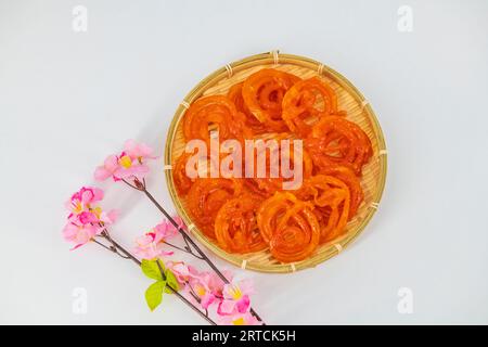 Jalebi or Jilebi Jangri - traditional Indian festival sweet isolated with white background. Popular Indian sweet Jalebi and Fafda served with Sambhara Stock Photo