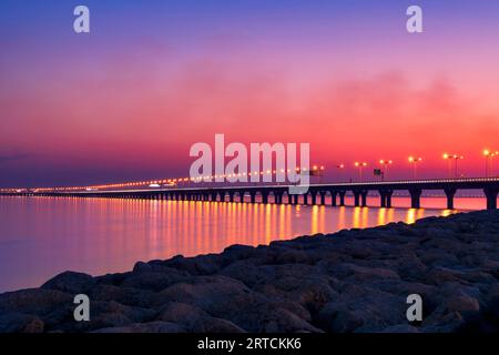 Kuwait Sheikh Jaber Al-Ahmad Al-Sabah Causeway during the evening after sun set. Kuwait Sea Bridge at the evening. Stock Photo