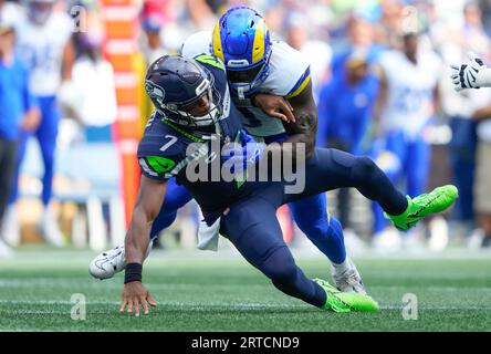 Los Angeles Rams linebacker Byron Young (0) runs during the first half of  an NFL preseason