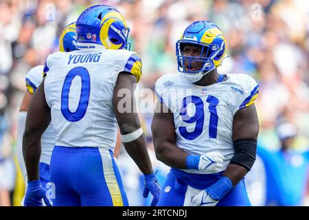 Los Angeles Rams linebacker Byron Young (0) runs during the first half of  an NFL preseason