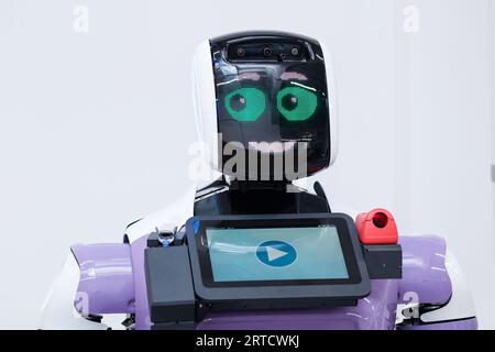 Perm, Russia - July 13, 2023: friendly humanoid robot guide expressing ...