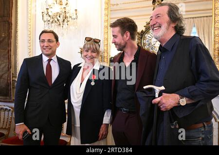 Prague, Czech Republic. 12th Sep, 2023. Actress Chantal Poullain (2nd left) receives National Order of Legion of Honour from French Ambassador in Prague Alexis Dutertre (left), Czech Republic, September 12, 2023. Poullain was born in 1956 in Marseille. She studied at the Theatre Academy in Geneva. After meeting Czech actor Boleslav Polivka (right), she moved to then Czechoslovakia in 1982. In 1989, their son Vladimir (2nd right) was born, who is now also an actor. She has appeared in many plays, musicals as well as films. Credit: Michal Kamaryt/CTK Photo/Alamy Live News Stock Photo