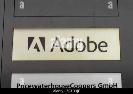 Adobe door bell sign with the logo of the company in an office building. Branch of the American computer software and technology company. Stock Photo