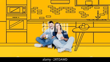 Smiling young european couple enjoy cups of coffee, dreams of own house, buy new home, in kitchen interior Stock Photo