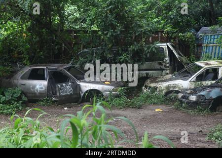 Dhaka, Bangladesh – September 12, 2023: Impounded vehicles have been left to rot under the open sky at Shahbagh Police Station’s dumping ground at Suh Stock Photo