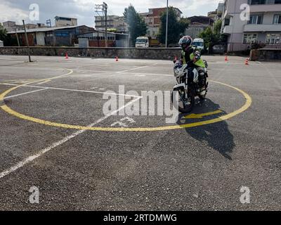 Bursa Turkey - September 09 2023 Man is practicing driving a motorcycle in a driving school . High quality photo Stock Photo