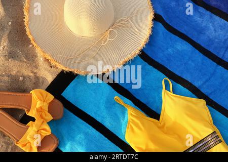 Composition with stylish beach accessories on sand Stock Photo