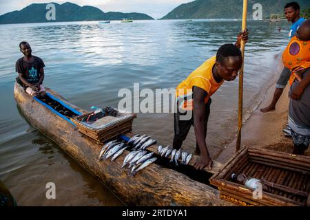 Cape Maclear, Malawi. Fishermen dock their boat after catching several fish in Lake Malawi. Editorial use only. Stock Photo