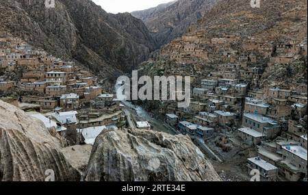 View of a river flowing through a mountain village in the Zagros Mountains; Kermanshah, Iran Stock Photo