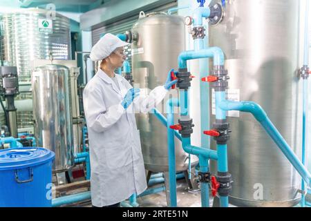 Specialist in factory checking bottles and Reverse osmosis system for water drinking plant. Stock Photo