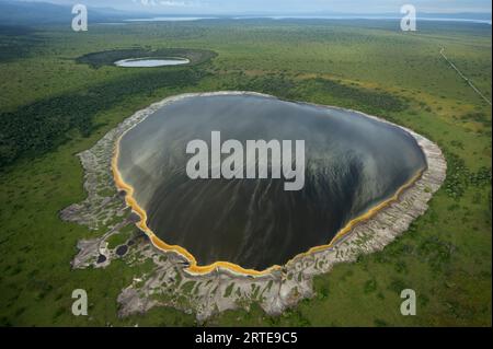 Crater lake formed by volcanic explosion in Queen Elizabeth National Park in Uganda; Uganda Stock Photo