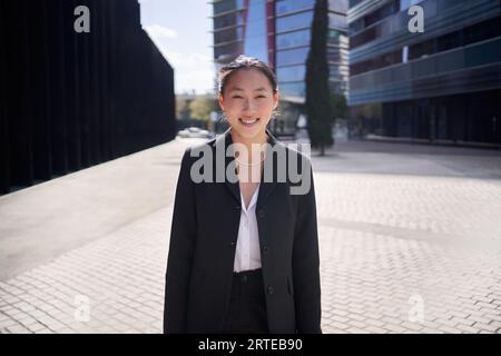 Portrait of smiling young Asian business woman looking at camera. Confident Chinese female formal. Stock Photo
