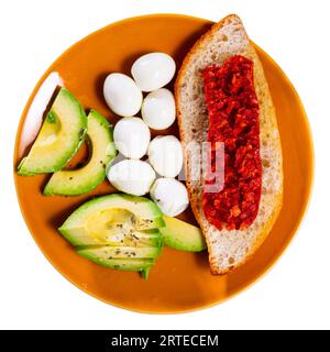 Avocado, eggs and toast served for breakfast Stock Photo