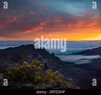 Sunrise above the clouds from Haleakala crater on the island of Maui, Hawaii, USA; Haleakala, Maui, Hawaii, United States of America Stock Photo