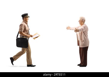 Mailman delivering a letter to a happy elderly woman isolated on white background Stock Photo