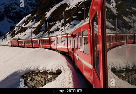 Glacier Express train in the Swiss Alps between Sedrun and Andermatt; Andermatt, Switzerland Stock Photo