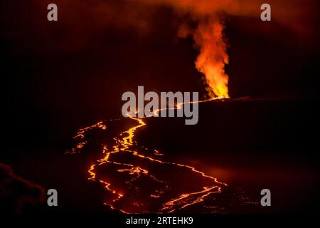 Fiery Lava flow of the 2022 eruption of Mauna Loa Volcano (Moku‘āweoweo, the world's largest active volcano) on the Big Island of Hawaii Stock Photo