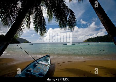 Boat on a sandy beach at Charlotteville, Tobago; Charlotteville, Tobago, Republic of Trinidad and Tobago Stock Photo