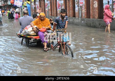 After continuous rain for 1 hour, water freezes in Jigatola & people's travel became very difficult. Dhaka, Bangladesh. 11th Sep, 2023. (Photo by Md. Saiful Amin/Pacific Press/Sipa USA) Credit: Sipa USA/Alamy Live News Stock Photo