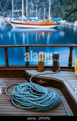 Sailing yachts at anchor in striking blue waters; Ekincik Bay, Turkey Stock Photo