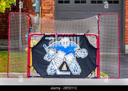 Hockey goal.Many neighbourhoods in Canadian cities, a common sight of playing hockey in the backyard. Hockey is a common image here.Canadian sport. Stock Photo