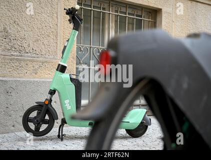 Berlin, Germany. 12th Sep, 2023. A 'Bolt' e-scooter stands behind a bicycle on the sidewalk. Few use e-scooters, but many are annoyed by the battery-powered scooters - especially in big cities. Credit: Carla Benkö/dpa/Alamy Live News Stock Photo