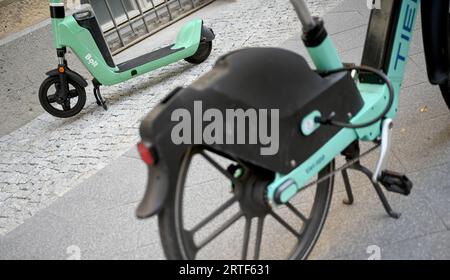 Berlin, Germany. 12th Sep, 2023. A 'Bolt' e-scooter stands behind a bicycle on the sidewalk. Few use e-scooters, but many are annoyed by the battery-powered scooters - especially in big cities. Credit: Carla Benkö/dpa/Alamy Live News Stock Photo