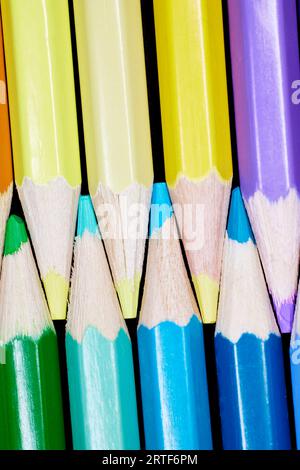 Close up of a row of colored pencils aligned together Stock Photo
