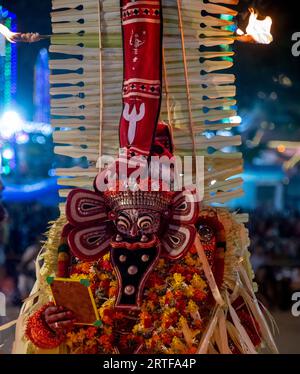 Capturing the Soul of Kerala: Theyyam Dances Unveiled. Celebrating the Vibrant Traditions of Kerala's Theyyam Dances Stock Photo