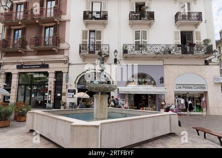 Aix-Les-Bains, France. 6th June, 2023. A fountain with a statue on a city center street in Aix-les-Bains, Savoie, France. Stock Photo