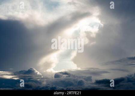 Dramatic sky with grey clouds over the city before the storm. Weather before or after a storm. Stock Photo