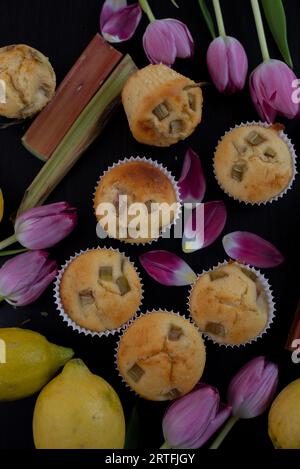 sweet home make lemon rhubarb muffins with tulips Stock Photo