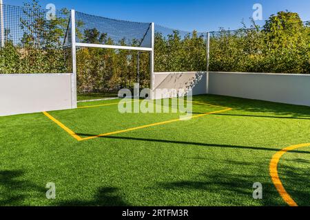 Playing field for small garden with artificial lawn, synthetic turf playing field, artificial grass pitch Stock Photo