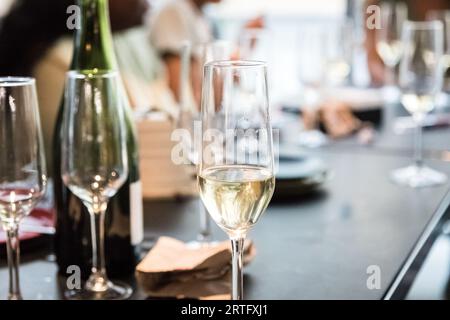 Champagne and champagne glasses on a table. Party and social life concept. Selective focus Stock Photo