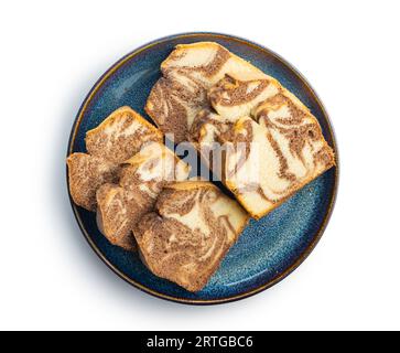 Marble sponge cake. Cake with cocoa and vanilla taste isolated on plate on the white background. Stock Photo