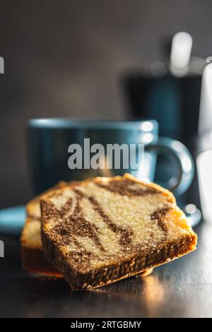 Marble sponge cake and coffee cup. The cake with cocoa and vanilla taste. Stock Photo