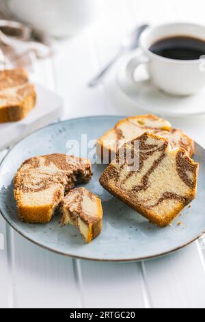 Marble sponge cake. Cake with cocoa and vanilla taste on the plate. Stock Photo