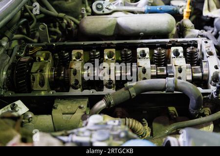 combustion engine of german SUV with removed valve cover and rocker arms shaft during motor repair process Stock Photo
