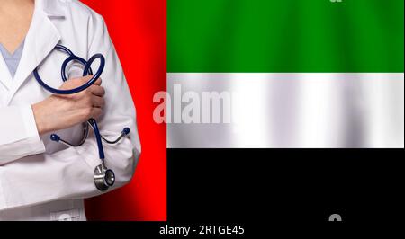 UAE medicine and healthcare concept. Doctor close up against flag of United Arab Emirates background Stock Photo