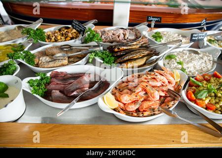 delicious shrimp on a serving plate on the buffet table in the restorant. Seafood buffet lunch in a cafe Stock Photo