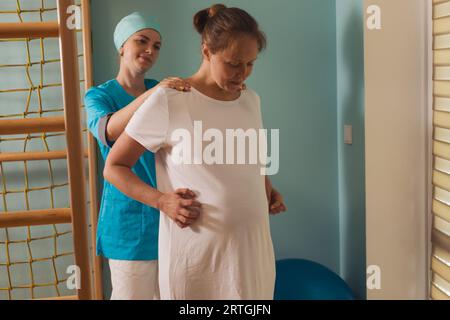 Pregnant woman trying to breath to soothe the pain of her labor contractions Stock Photo