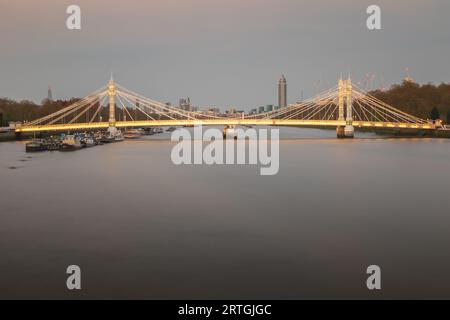 Long exposure, illuminated Albert bridge over river Thames in London Stock Photo