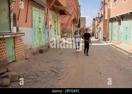 Amizmiz, Morocco. 12th Sep, 2023. Two Berber children, survivors of the earthquake, walk down a street in the small town of Amizmiz. The region of Amizmiz was one of the worst affected by the earthquake in Morocco on Friday 8 September, which killed more than 2,000 people. Hundreds of people have been left homeless. Credit: SOPA Images Limited/Alamy Live News Stock Photo