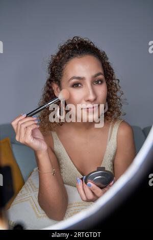 Cosmetic glow, makeup brush on face and black woman with skincare in studio,  cosmetics tool. Skin care, blush and foundation, African beauty model Stock  Photo - Alamy